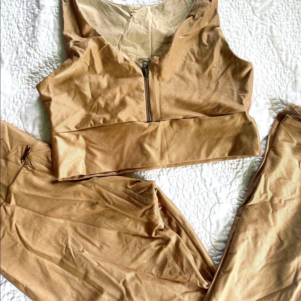 Mika brand Yoga Nude Champagne Shimmer bra and legging set.